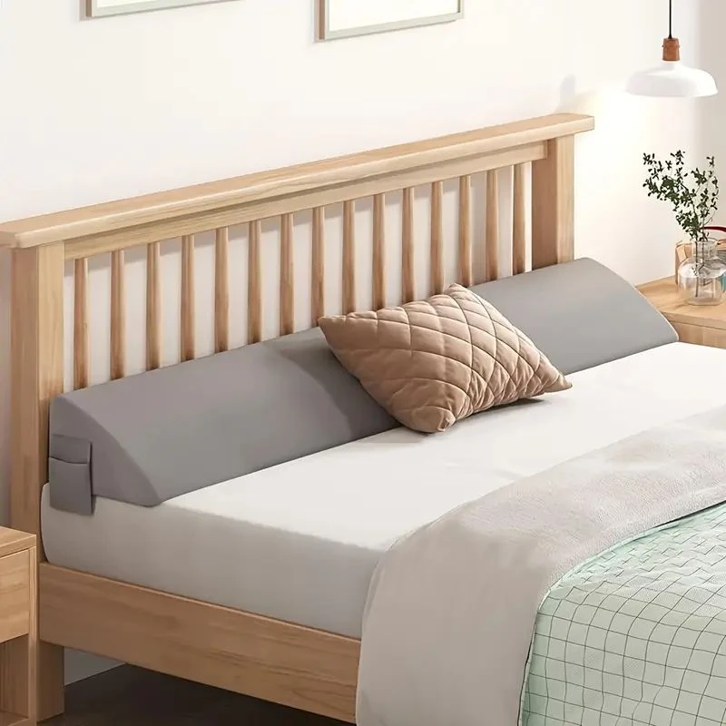 Gray headboard gap cushion on an adult bed